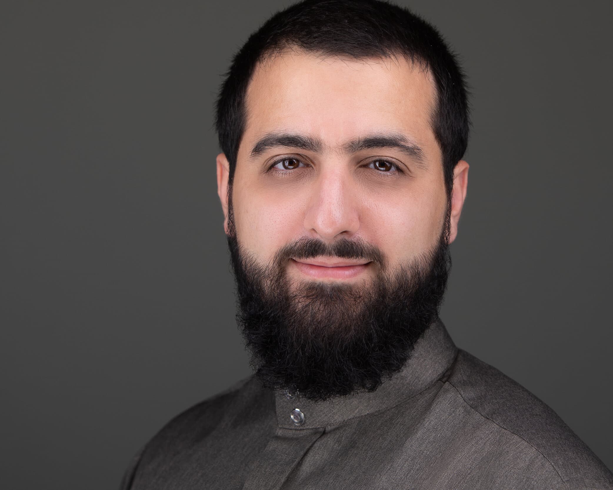 Professional headshot of Abdullah